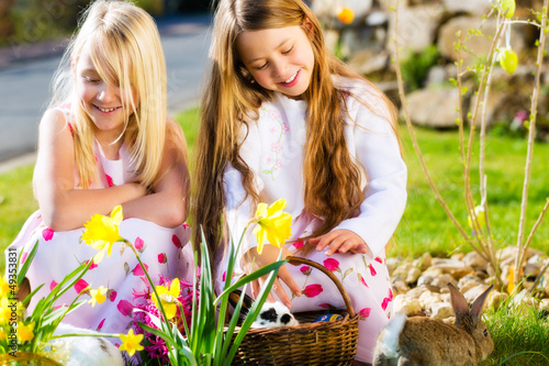 Photo: Children on Easter egg hunt with bunny Children on Easter egg hunt with bunny