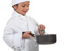 Young chef mixing a sauce