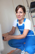 Woman painting a wall