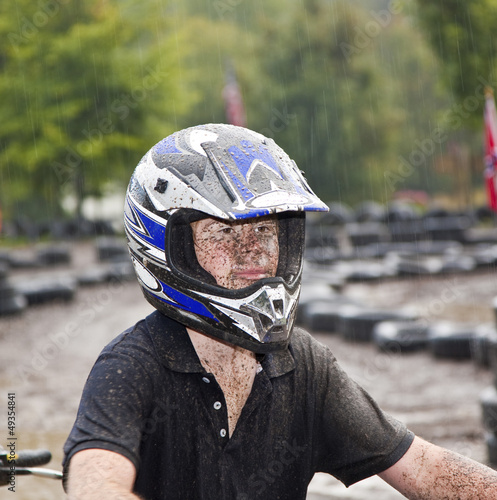 Photo: young boy is faszinated by quad driving and enjoyes is, his face young boy is faszinated by quad driving and enjoyes is, his face