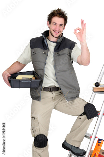 Photo: Approving tile fitter posing with his tools Approving tile fitter posing with his tools