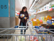 Photo: Woman at the supermarket with trolley Woman at the supermarket with trolley