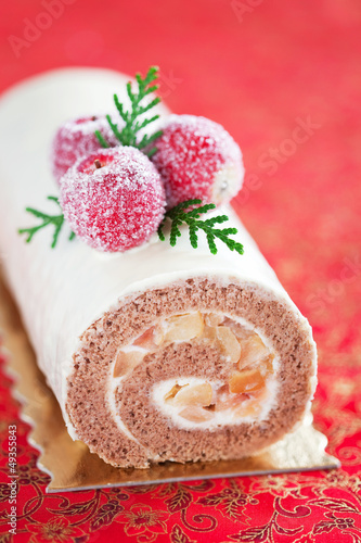 Photo: Swiss roll with cinnamon and apples, selective focus Swiss roll with cinnamon and apples, selective focus