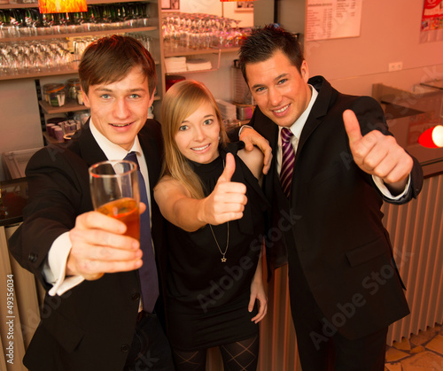 Photo: Three friends in a bar Three friends in a bar