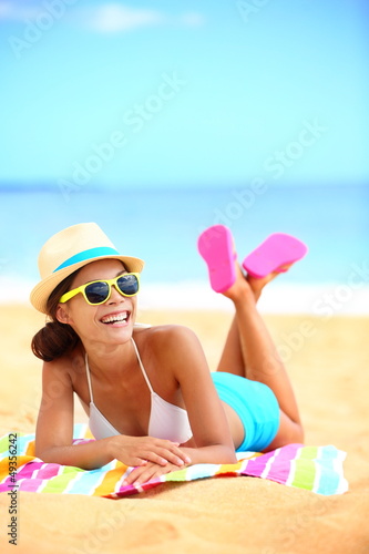 Photo: Happy beach woman laughing having fun Happy beach woman laughing having fun