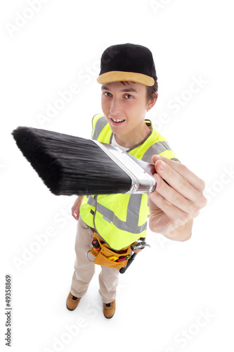 Photo: Young male with paintbrush Young male with paintbrush