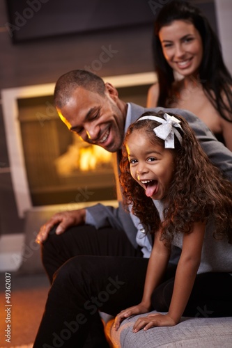 Photo: Happy diverse family having fun at home Happy diverse family having fun at home