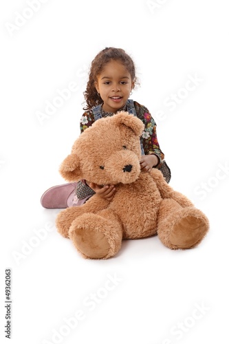 Photo: Beautiful little girl with huge plush bear Beautiful little girl with huge plush bear