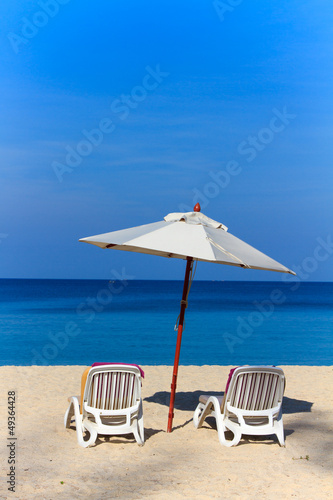 Photo: beds and umbrella on a beach beds and umbrella on a beach