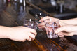 hands make cheers with glasses