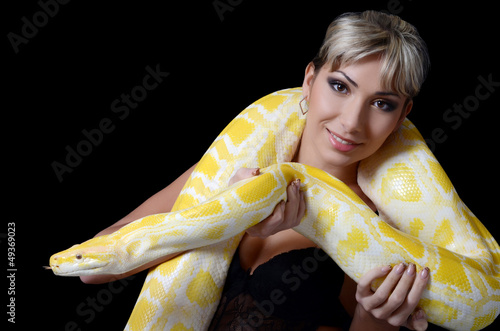 Photo: The beautiful woman with the big yellow snake The beautiful woman with the big yellow snake