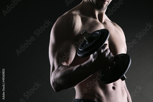 Photo: Exercising biceps with dumbbells Exercising biceps with dumbbells