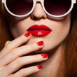 Beautiful woman with bright make-up and sunglasses