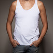 White t-shirt on a young man template on gray background