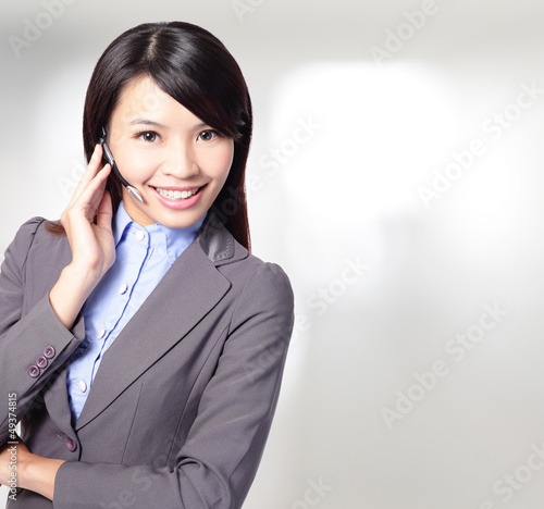 Photo: beautiful customer service operator woman with headset beautiful customer service operator woman with headset