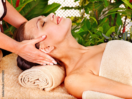 Photo: Woman getting facial massage . Woman getting facial massage .