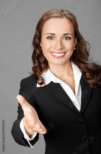 Photo: Businesswoman giving hand for handshake Businesswoman giving hand for handshake