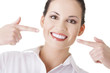Woman showing her perfect straight white teeth.
