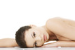 Sexy fit naked woman lying down