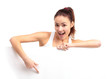 Happy smiling young business woman showing blank signboard
