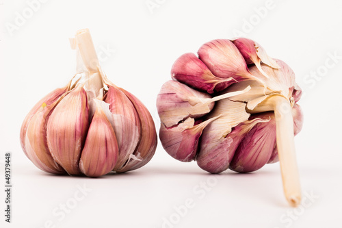 Photo: Garlic cloves isolated on white background Garlic cloves isolated on white background