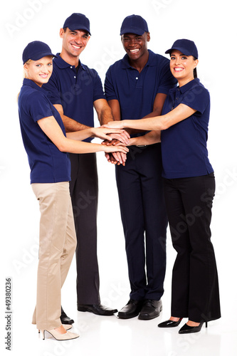 Photo: group of service industry staff hands together group of service industry staff hands together
