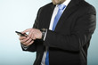 Photo: Businessman using smartphone. Businessman using smartphone.
