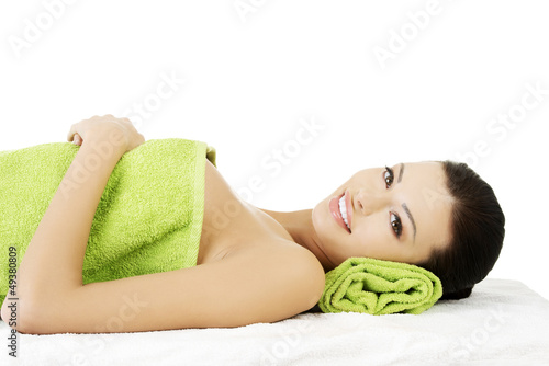 Photo: Beauty young woman relaxing in spa. Beauty young woman relaxing in spa.