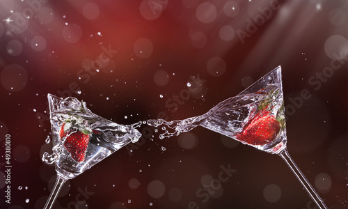 Photo: Martini drinks splashing out of glass Martini drinks splashing out of glass