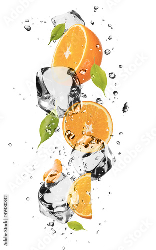 Photo: Oranges with ice cubes, isolated on white background Oranges with ice cubes, isolated on white background