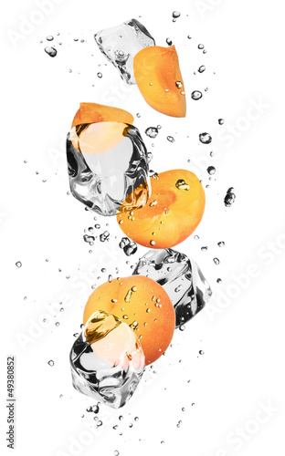 Photo: Apricots with ice cubes, isolated on white background Apricots with ice cubes, isolated on white background