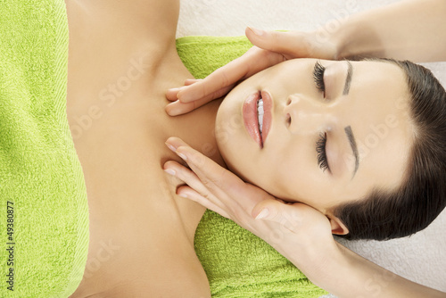 Photo: Face massage therapy at spa saloon Face massage therapy at spa saloon