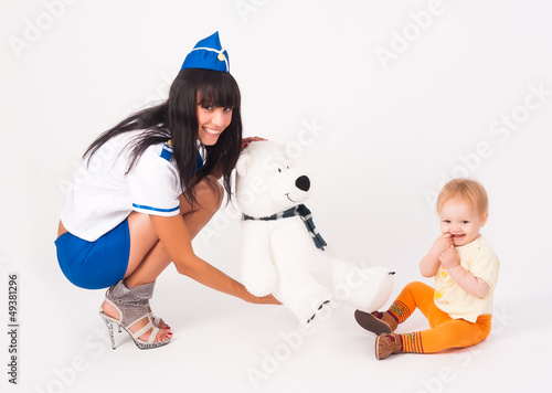 Photo: Attractive stewardess and baby girl Attractive stewardess and baby girl