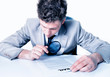 Businessman with magnifying glass analyze contract