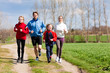 Photo: Family is running outdoors Family is running outdoors
