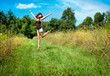 Photo: Woman jumping on nature walkway Woman jumping on nature walkway