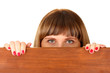 Photo: Woman peeking from wooden desk, isolated on white Woman peeking from wooden desk, isolated on white