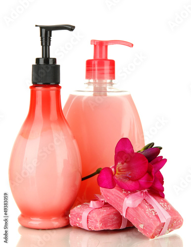 Photo: Liquid and hand-made soaps isolated on white Liquid and hand-made soaps isolated on white
