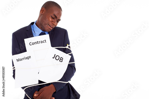 Photo: african american businessman in deep trouble african american businessman in deep trouble