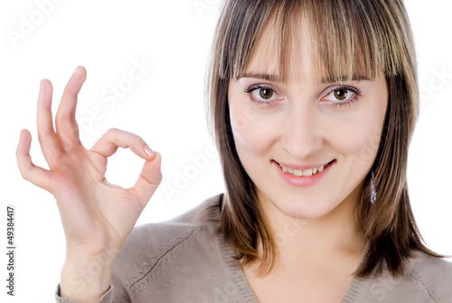 Photo: Woman showing okay gesture Woman showing okay gesture