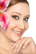 Smiling woman lily in hair