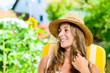 Woman tanning in her garden on lounge chair