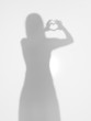 female silhouette making a heart shape with her hands