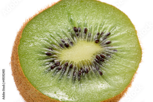 Photo: Cross Section of Kiwi Fruit Close-Up on White Background Cross Section of Kiwi Fruit Close-Up on White Background