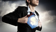 Businessman showing superman suit underneath shirt