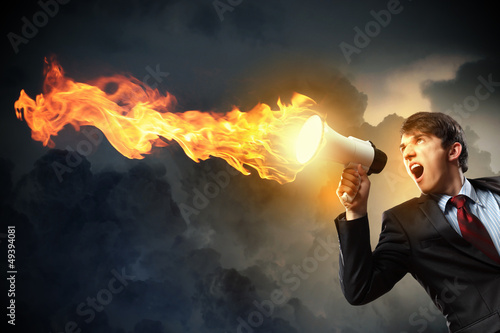 Photo: businessman with megaphone businessman with megaphone