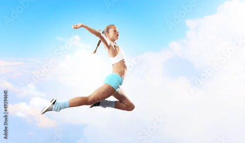 Photo: Image of sport woman jumping Image of sport woman jumping
