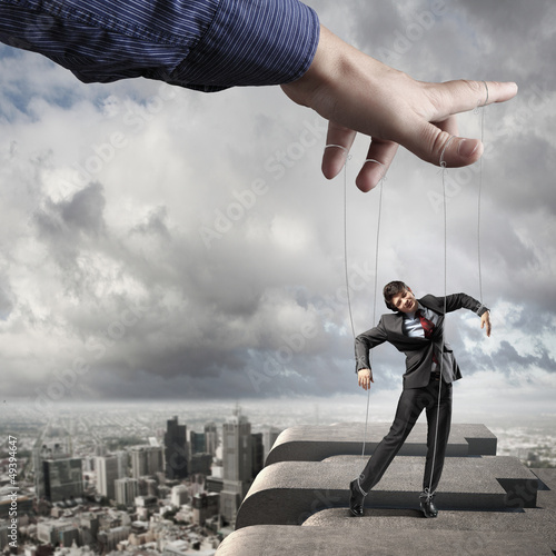 Photo: Business man marionette Business man marionette