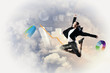 businesswoman in black suit jumping