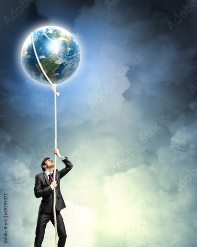 Photo: Image of businessman climbing rope Image of businessman climbing rope